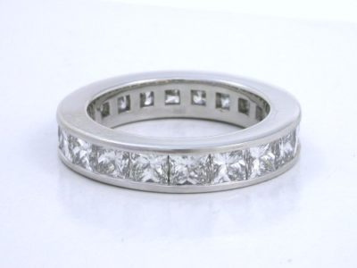 Platinum channel set princess diamond eternity band