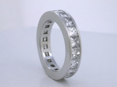 Diamond Wedding Band: 5.06 tcw Princess Cut Channel Set Diamond Eternity Band