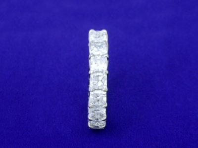 4.84 total carat weight of square radiant cut diamonds in trellis-style eternity band