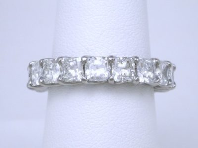 4.84 total carat weight of square radiant cut diamonds in trellis-style eternity band