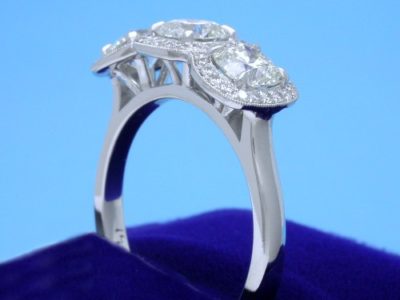 Three-Stone Cushion Diamond Ring with Pave Halos
