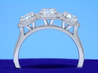 Cushion 3-Stone Diamond Ring with Modified Baskets to Accommodate Flush Fitting Wedding Band