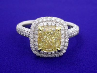 Cushion Cut Fancy Yellow Diamond Ring with 1.14 tcw Pave Halo and Shank