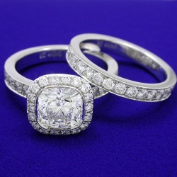 2.02 carat Cushion Cut diamond graded F color and VS2 clarity in an 18-karat white-gold mounting with 1.23 total carat weight of pave diamonds Matching diamond and 18-karat white-gold band with 0.98 total carat weight of pave diamonds