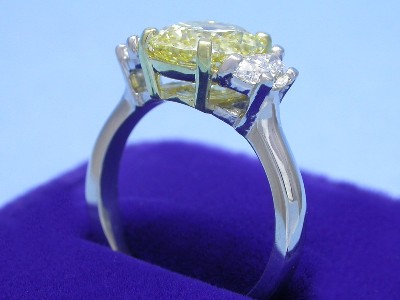 Cushion Cut Diamond Ring: 2.60 carat Fancy Intense Yellow with 1.16 ratio with 0.70 tcw Half Moon diamonds
