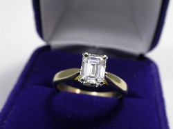 1.00 carat Emerald Cut Diamond grade G color, VS1 clarity with 1.31 ratio in 18-karat yellow gold mounting with platinum basket style head