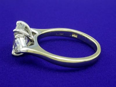 Emerald Cut and Triangular Diamond Three Stone Ring