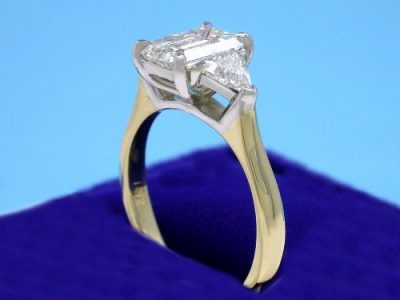 Emerald Cut and Triangular Diamond Three Stone Ring