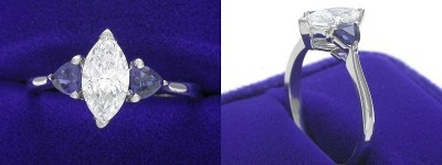 Marquise Cut Diamond Ring: 0.79 carat with 1.90 ratio in 0.45 tcw Blue Sapphire Trillion Three Stone mounting