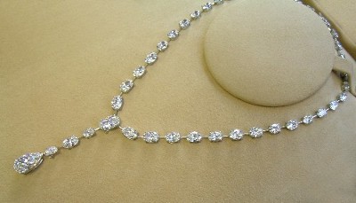 Oval Cut Pendant: 52.21 tcw Oval Diamonds and 10.23 carat Pear Shaped Diamond