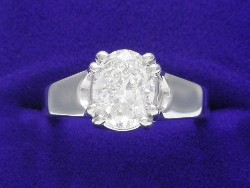 1.51 carat Oval Brilliant diamond ring with H color and SI1 clarity set in a 14-karat white gold Trellis style mounting.