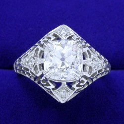 2.33 carat Old Mine Cut diamond graded I color, VS1 clarity in vintage-style mounting and matching diamond bands