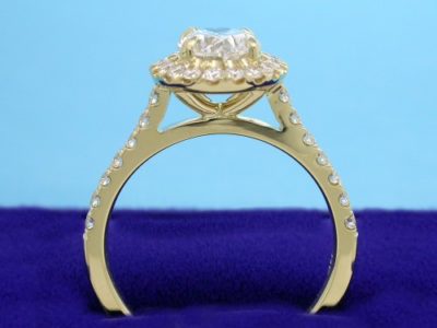 14-karat yellow-gold mounting with U-set round diamonds 1.3 mm on the halo and 1.5 mm going half way down the shank