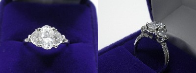 Oval Diamond Ring: 1.08 carat with 1.43 ratio in 0.60 tcw Crescent Moon Cut diamond three-stone mounting