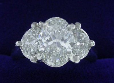 Oval Cut Diamond Ring: 1.50 carat with 0.61 tcw Half Moon diamonds