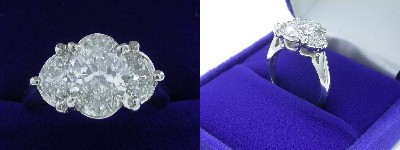 Oval Diamond Ring: 1.50 carat with 1.40 ratio in 0.61 tcw Half Moon Cut diamond three-stone mounting