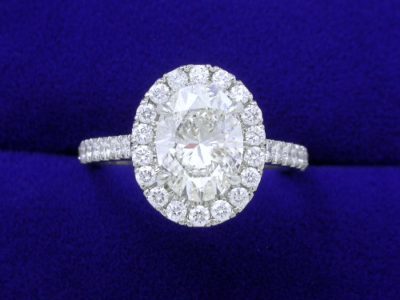 Oval Cut Diamond Ring: 1.50 carat with 1.35 ratio in 0.63 tcw Pave Halo and Shank Mounting