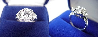 Oval Diamond Ring: 1.52 carat with 1.41 ratio in 0.57 tcw Half Moon Cut diamond three-stone mounting