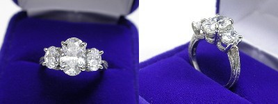 Oval Diamond Ring: 1.59 carat with 1.54 ratio in 0.87 tcw Oval Cut diamond three-stone mounting