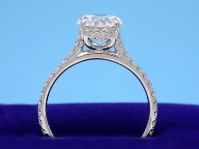 French-set pave diamonds on underbezel and going three-fourths the way down the shank