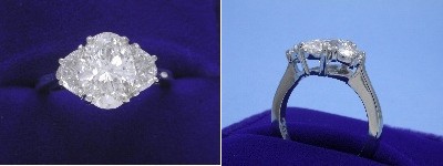 Oval Diamond Ring: 2.05 carat with 1.41 ratio in 0.71 tcw Crescent Moon Cut diamond three-stone mounting