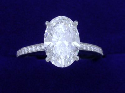 Oval Cut Diamond Ring: 2.21 carat with 1.48 ratio and 0.29 tcw pave diamonds