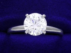 1.26 carat Round Brilliant Cut diamond with F color and SI1 clarity in a 4 prong ring