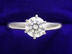0.90 carat Round Brilliant Cut diamond graded I color and VS2 clarity in 6-prong platinum mounting