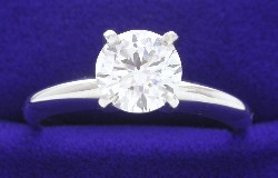 1.02 carat Round Brilliant Diamond graded H color, SI1 clarity in four-prong Solitaire style mounting