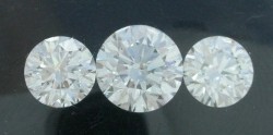 Three loose Round Brilliant G color, VS2 clarity diamonds with 1.14 carat center and 1.23 carat side stones.