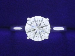 1.20 carat Round Brilliant cut diamond graded I color and VS2 clarity set in a 14-karat white-gold cathedral-style mounting.