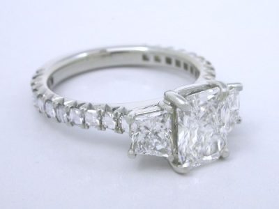 Radiant Cut Diamond Ring: 1.13 carat with 0.60 tcw Brilliant-Cut Trapezoids and 0.56 tcw Blaze Cut diamonds