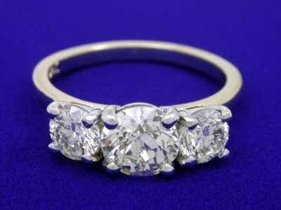 Round Diamond Ring: 1.11 carat with 0.92 tcw Round Side Diamonds in Two-Tone Mounting