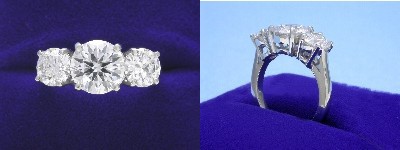 Round Diamond Ring: 1.38 carat Three Stone with 1.07 tcw Round Diamonds