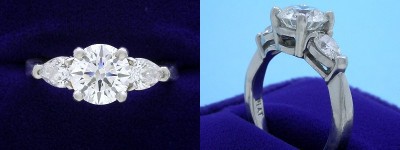 Round Diamond Ring: 1.41 carat with 0.59 tcw Pear Shaped diamonds