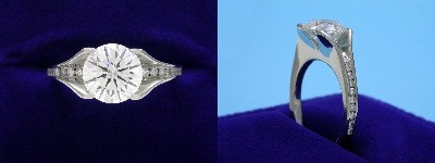 Round Diamond Ring: 2.05 carat in Bez Ambar mounting with 0.30 tcw Channel Set Diamonds