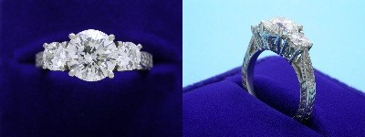 Round Diamond Ring: 2.13 carat Three Stone with 0.72 tcw Round Diamonds