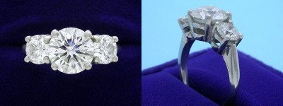 Round Diamond Ring: 2.13 carat with 1.12 tcw Round Diamonds in 3-Stone Mounting