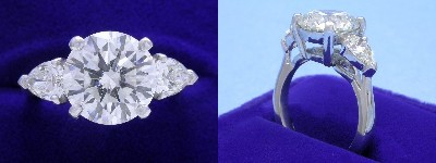 Round Diamond Ring: 3.94 carat with 0.92 tcw Pear Shaped Diamonds