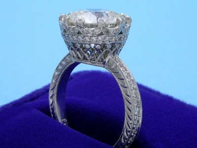 Special Offer: Round Cut 5.05 carat with 0.89 tcw Pave Diamond Ring