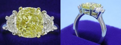 Cushion Cut Diamond Ring: 2.60 carat Fancy Intense Yellow with 1.16 ratio and 0.70 tcw Half Moon side diammonds