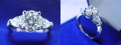 Round Diamond Ring: 1.41 carat with 0.59 tcw Pear shaped diamonds